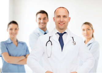 smiling male doctor with stethoscope