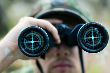 close up of soldier or hunter with binocular