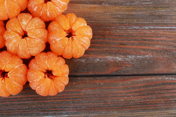 Tangerines on wooden background