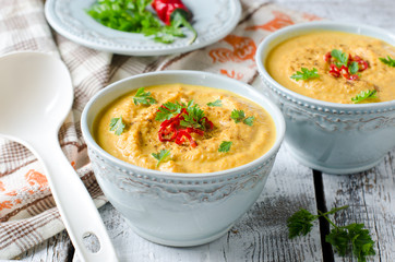 Carrot cream soup with red chili pepper