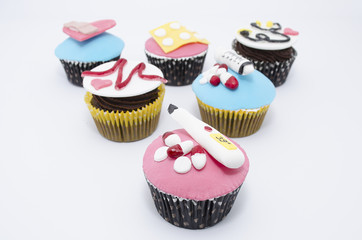 Cupcakes with medical equipment made of fondant