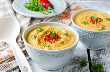 Carrot cream soup with red chili pepper