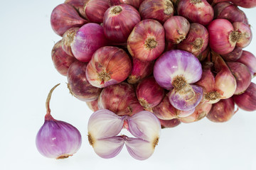 Shallot onions in a group on white background.