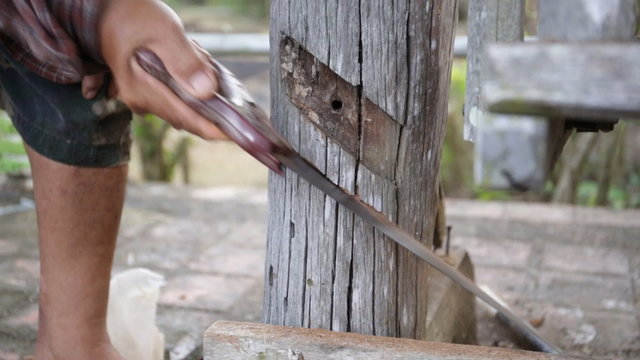 Closeup of Carpenter use equipment to repare the furniture