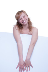 Obraz premium Young woman posing with a placard