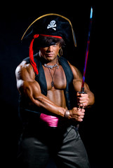 Portrait of a muscular man in a pirate costume