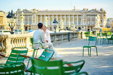 Bride and groom in the Tuileries garden of Paris