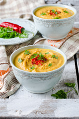 Carrot cream soup with red chili pepper