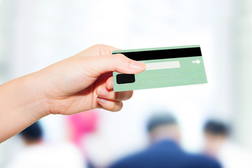 female hand holding credit card