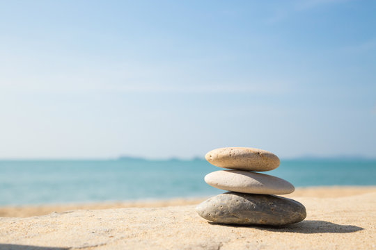 Stones balance, pebbles stack on sea sand beach