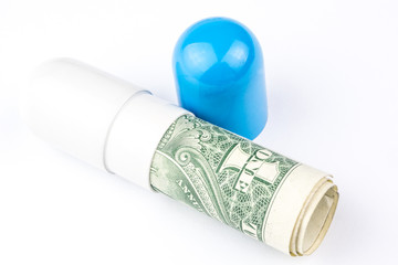 one dollar banknote is rolled into a big blue and white capsule