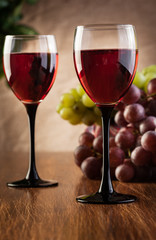 Glasses of red wine and bottle