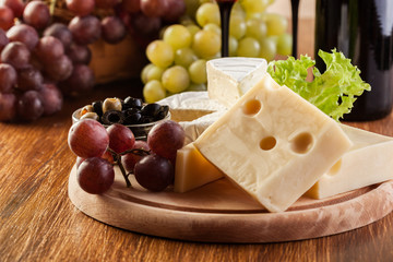 Cheese, olive and grapes