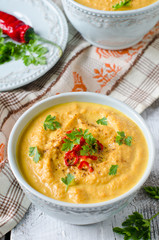Carrot cream soup with red chili pepper