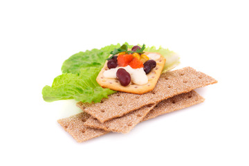 Crackers with fresh vegetables and cream