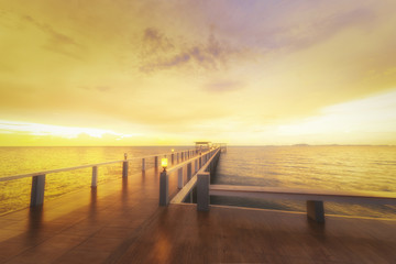 Fototapeta na wymiar Landscape of Wooded bridge in the port between sunrise