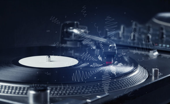 Turntable playing music with hand drawn cross lines