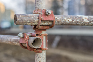 Close of rusty metal scaffolding connector