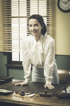 1950s Business Woman Leaning On Desk