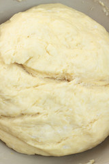 Bowl full of dough ready for rolling.
