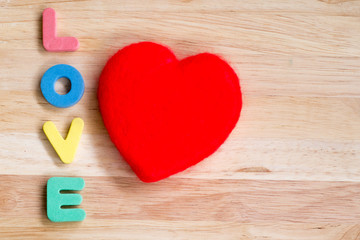 Valentines Day background red heart on wooden background