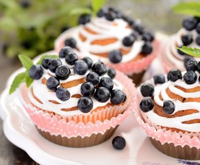 Homemade blueberry muffins in paper cupcake holder