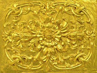 Golden Thai decorative pattern on temple wall