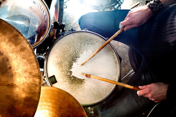Man playing the drum.Live music background concept.Drummer