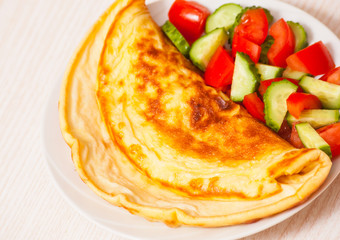 Omelet with vegetable salad
