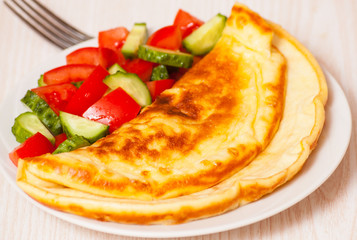 Omelet with vegetable salad