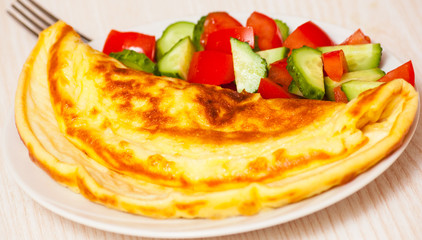 Omelet with vegetable salad