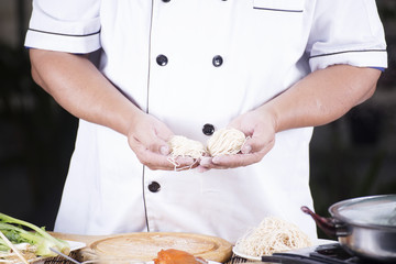 Chef present noodle before cooking