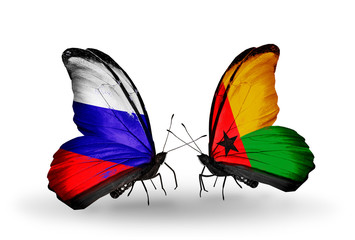 Two butterflies with flags Russia and Guinea Bissau