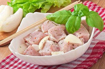 Prepared marinated with onions and herbs pieces of meat 