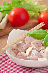 Prepared marinated with onions and herbs pieces of meat 