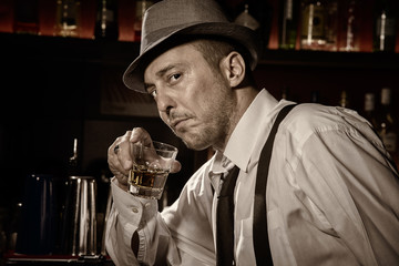 Vintage portrait of a man drinking at a bar