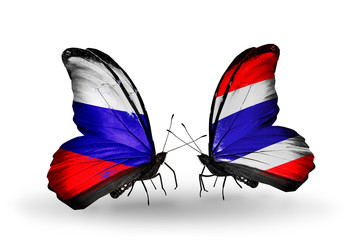 Two butterflies with flags Russia and Thailand