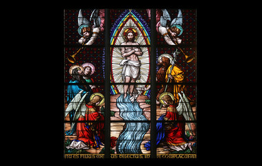 Obraz premium Baptism of the Christ, Stained glass in Votiv Kirche in Vienna