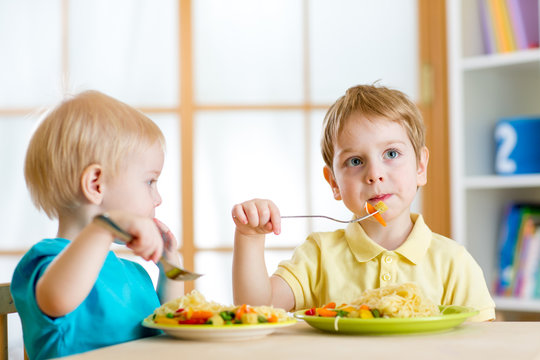 kids eating in kindergarten or at home