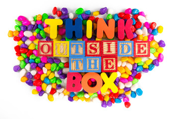 thinkd outside the box word in colorful stone