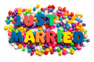 just married word in colorful stone