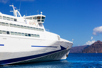 Fototapeta na wymiar Modern cruise ship sailing on Aegean sea, Santorini Greece.