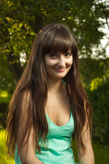 Obraz premium outdoor portrait of beautiful girl with sincere cute smile