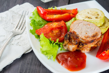 roasted pork steak with grilled vegetables