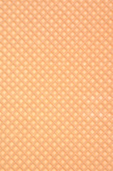 Golden waffle background with regular pattern 