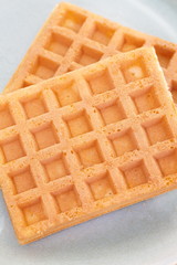 Delicious sweet waffle in ceramic plate on white plate