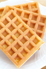 Delicious sweet waffle in ceramic plate on white plate