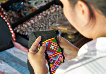Weaving of a Dusun tindal traditonal dress pattern, locally know