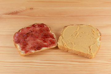 Slices of fresh bread with jelly and peanut butter