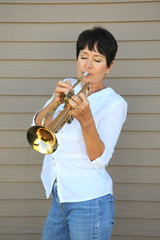 Mature female trumpet player.